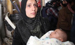 A mother and child in Yarmouk, Syria.