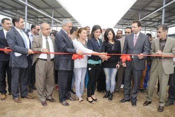Students cut the ceremonial ribbon at the opening of the Dawodiyah Secondary School in Dohouk, Kurdistan, Iraq.