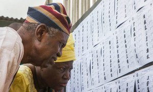 Nigerians going over the electoral lists ahead of the Gubernatorial and State House of Assembly elections on 11 April 2015.