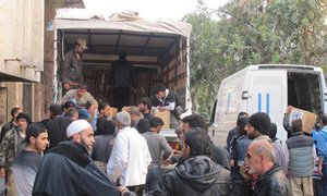UNRWA distributing aid in Yalda, an area adjacent to Yarmouk, Syria, hosting displaced civilians.