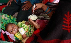 A woman feeds her infant, who was injured during the massive 25 April earthquake, at Tribhuvan University Teaching Hospital in Kathmandu, the capital of Nepal.