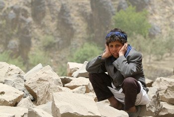 A boy sits amid rubble, all that remains of his home, which was destroyed in an air strike in Okash Village, near Sana’a, the capital of Yemen.