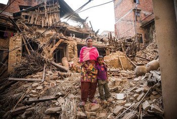 A woman and her child in Khokhana town on the outskirts of Kathmandu, Nepal, after the earthquake destroyed their home.