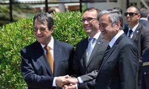 Special Adviser on Cyprus Espen Barth Eide (centre)  with Greek Cypriot leader Nicos Anastasiades (left) and the Turkish Cypriot leader Mustafa Akinci as they resumed full-fledged negotiations on 15 May 2015.