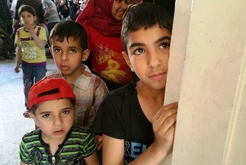 Children queue up at the UNRWA medical point in Yalda.