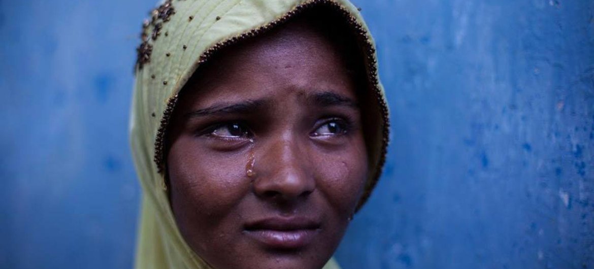 A boat survivor rescued by fishermen in East Aceh, Indonesia.