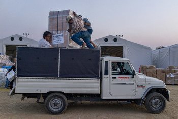 Volunteers load UNHCR relief supplies onto a truck at Tribhuvan International Airport in Kathmandu, Nepal. The aid will be distributed to affected areas across the country.