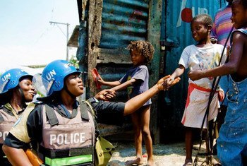 Members of a Formed Police Unit serving with the UN Stabilization Mission in Haiti (MINUSTAH) patrol a neighborhood in the capital, Port-au-Prince (2009).