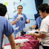 A patient is attended to by medical staff at the San Juan de Dios Hospital in Guatemala.