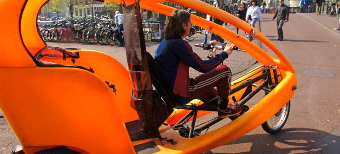 Bicycle-taxi in the streets of Amsterdam, Netherlands.