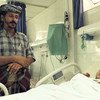 Five-year old Hussein, who spent four days in a coma, is looked over by his father at a hospital in Sana’a. Source: UNIFEED video screen shot
