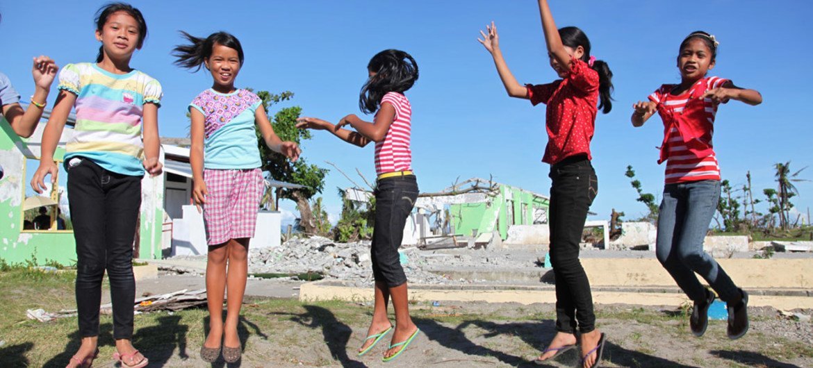 Girls play in the schoolyard at Santo Niño Elementary School in the town of Tanauan, Philippines.