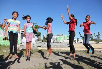 Girls play in the schoolyard at Santo Niño Elementary School in the town of Tanauan, Philippines.