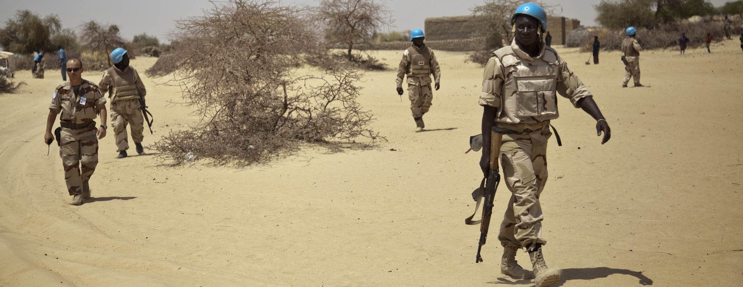 Peacekeepers from Burkina Faso patrol the streets in Ber, a little village 60 km north-east of Timbuktu, in Mali, in April 2014.