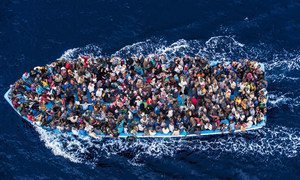 Hundreds of refugees and migrants aboard a fishing boat moments before being rescued by the Italian Navy as part of their Mare Nostrum operation in June 2014.