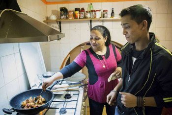 A Bangladeshi refugee family cook in their new restaurant in Budapest, Hungary where they have found security after a 20-year search for a safe home.