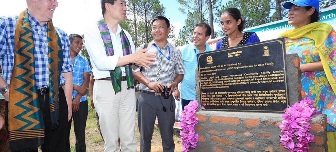 UNDP Asia Pacific Regional Director Haoliang Xu (second left) at the laying of the foundation stone of a ginger processing community facility centre in Thulosirubari Village, Sindhupalchowk, Nepal.