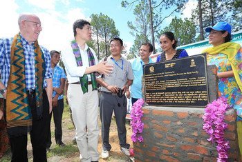 UNDP Asia Pacific Regional Director Haoliang Xu (second left) at the laying of the foundation stone of a ginger processing community facility centre in Thulosirubari Village, Sindhupalchowk, Nepal.