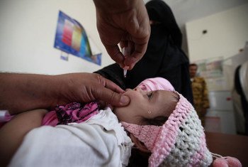 A child gets vaccinated for polio at Al-Olufi Health Center in downtown Sanaa.