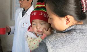 Children wait to receive nutritional supplements at a clinic in Nampo City, Democratic People's Republic of Korea. (file)