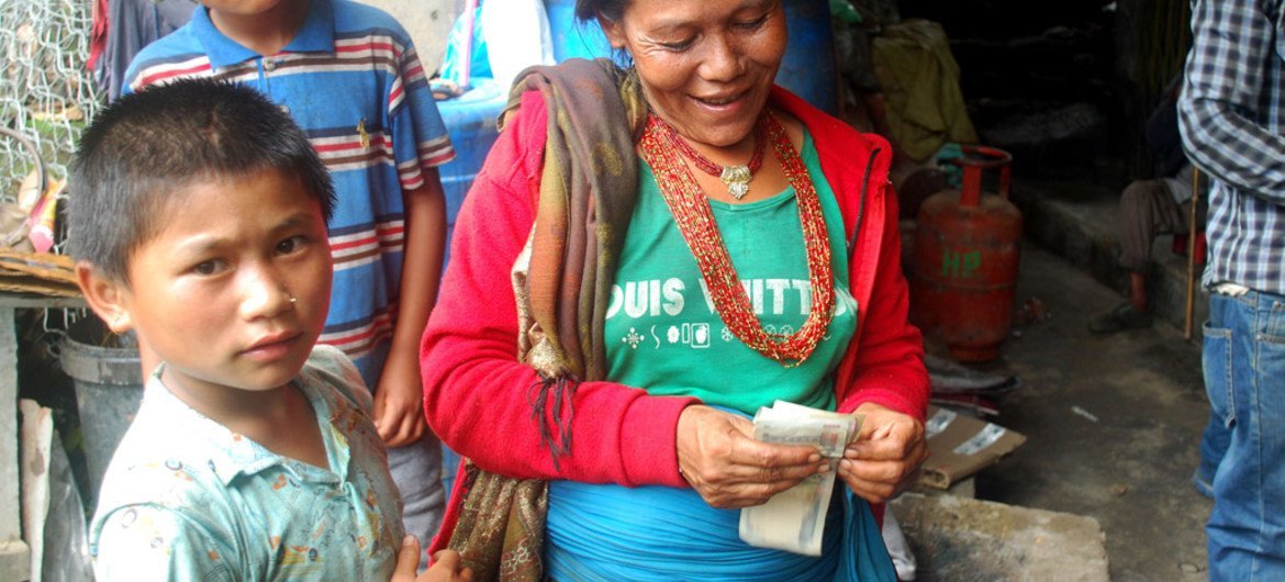 As part of the recovery effort in Nepal, humanitarian agencies are providing cash to the affected families through local shop keepers.