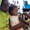 A child receives a vaccination against meningitis in E Fasher, North Darfur.