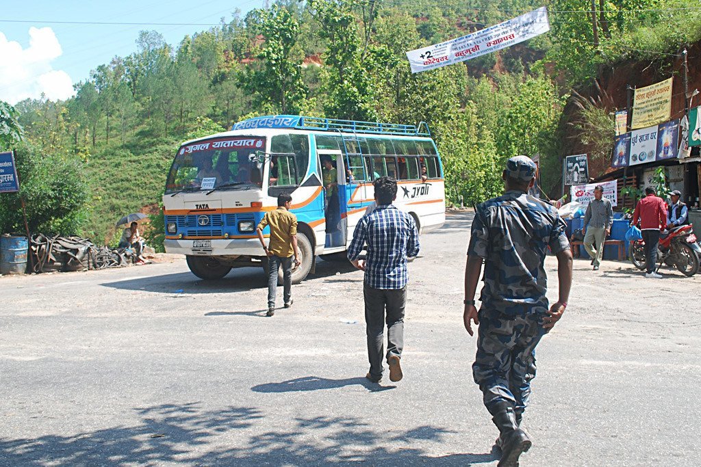 At the Bandeu checkpoint in Nepal, inspectors and a police constable approach a bus to look for potential victims of child trafficking onboard (file photo).