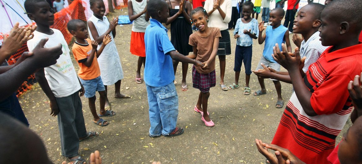 Children at Delmas 33 camp for displaced Haitians play inside a clean, safe area designated by independent organization Save the Children.