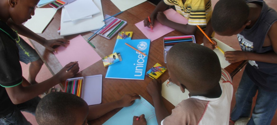 Children at a temporary shelter in Bujumbura, Burundi, use drawing to help them forget the turmoil they have gone through.