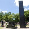 Secretary-General Ban Ki-moon (front, left) and his wife, Yoo Soon-taek (beside Mr. Ban), solemnly lay a wreath at the Hypocenter Monument at Nagasaki Peace Park, Japan during a visit in August 2010.