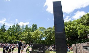 Secretary-General Ban Ki-moon (front, left) and his wife, Yoo Soon-taek (beside Mr. Ban), solemnly lay a wreath at the Hypocenter Monument at Nagasaki Peace Park, Japan during a visit in August 2010.