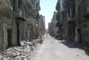 A street lined with rubble and destroyed buildings in the Old City area of Homs, Syria.