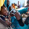 A child receives a vaccination against meningitis at the community centre in Al Neem camp for Internally Displaced People in El Daein, East Darfur, Sudan.