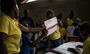 Officials in Haiti begin counting ballots at the end of polling on election day, 9 August 2015.