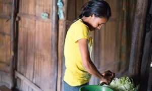 Delfina Soares, 13, in Lauana Groto, Timor-Leste, now attends a UNICEF supported child friendly school. Once she finishes school she has to make her family lunch. UNICEF/PFPG2015-3628/Nazer
