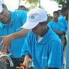 UNICEF Ambassador for South Asia, cricketing legend Sachin Tendulkar, teaches correct handwashing to a student in Colombo, Sri Lanka, 12 October 2015.