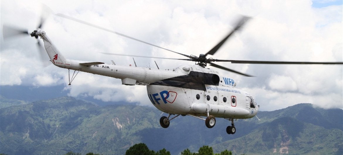 A United Nations helicopter takes off from Chautara, in Nepal’s Sindhupalchok District, to transport roofing material to a remote village to rebuild homes damaged in the earthquakes of April and May 2015.