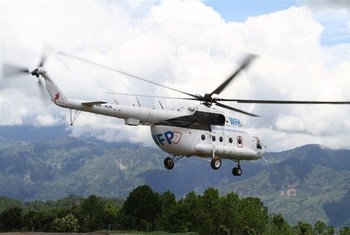 A United Nations helicopter takes off from Chautara, in Nepal’s Sindhupalchok District, to transport roofing material to a remote village to rebuild homes damaged in the earthquakes of April and May 2015.