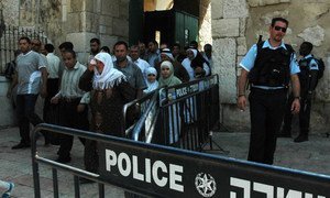 On the Temple Mount in the Old City of Jerusalem, Israel, Muslims leave the  Dome of the Rock after Friday prayers. Police presence is always tight and young males are not allowed or have their ID’s seized going in.