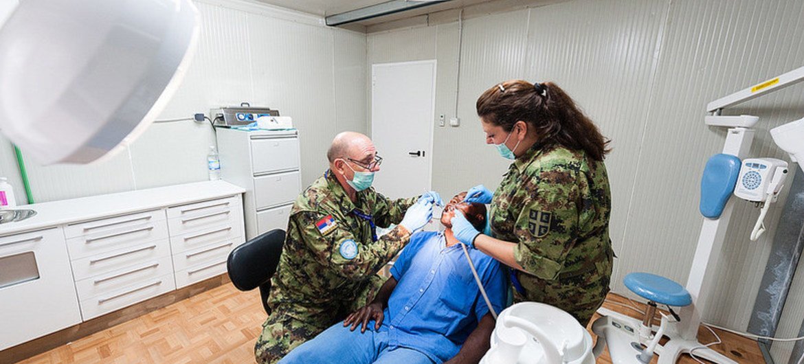 Serbian peacekeepers serving with the UN Multidimensional Integrated Stabilization Mission in the Central African Republic (MINUSCA) respond to medical needs at the MINUSCA hospital in Bangui on 8 May 2015.