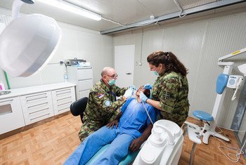 Serbian peacekeepers serving with the UN Multidimensional Integrated Stabilization Mission in the Central African Republic (MINUSCA) respond to medical needs at the MINUSCA hospital in Bangui on 8 May 2015.