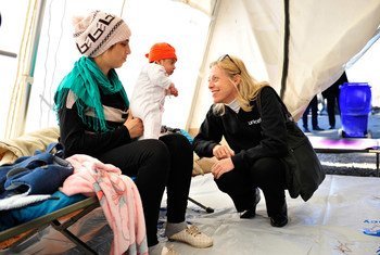 UNICEF Special Coordinator for the Refugee and Migrant Crisis in Europe Marie-Pierre Poirier (right) with refugee children in a UNICEF-supported Child Friendly Space set up at the reception centre in Opatovac, Croatia, on 30 October 2015.