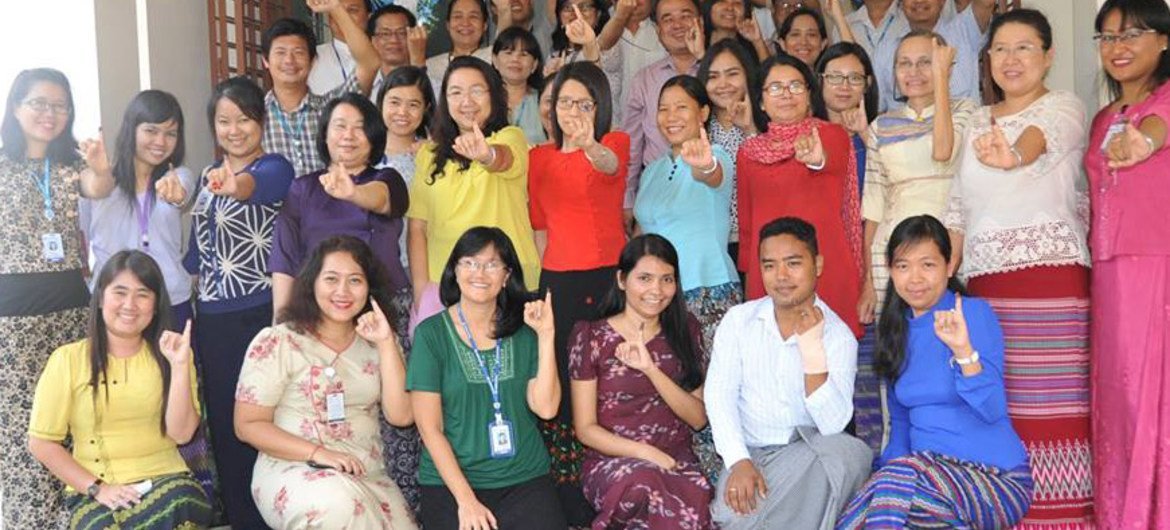 UNDP staff show off their purple pinkies, dipped in the indelible ink used in Myanmar’s historic elections, which was provided by UNDP through funding from Japan, Norway, Switzerland and the UK.