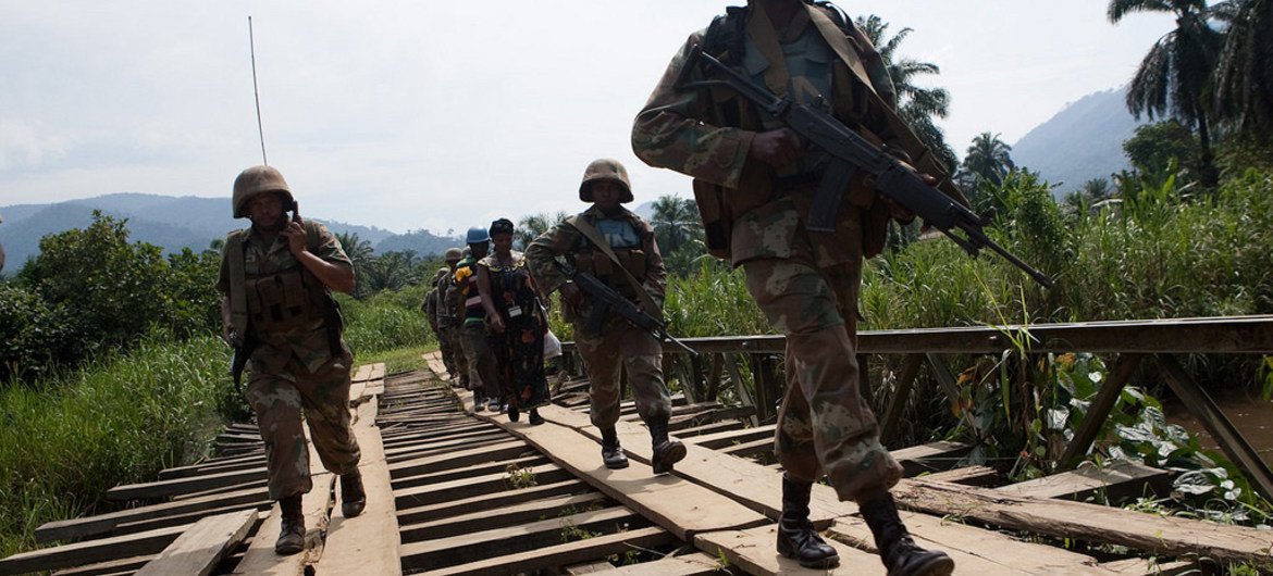 Peacekeepers of the MONUSCO Force Intervention Brigade patrol the town of Pinga as part of a mission to secure the area.