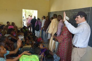 Head of Operations for the UN Office for the Coordination of Humanitarian Affairs (OCHA), John Ging (right), visits students in a classroom in Timbuktu, Mali.