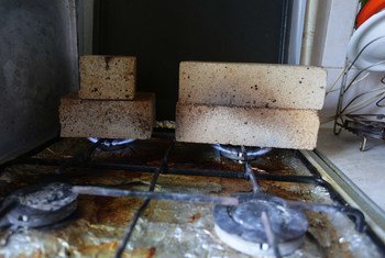 Families living in the conflict-affected areas of eastern Ukraine try to keep their houses heated by putting bricks on the gas oven. They are desperate to keep their children warm during these freezing months.