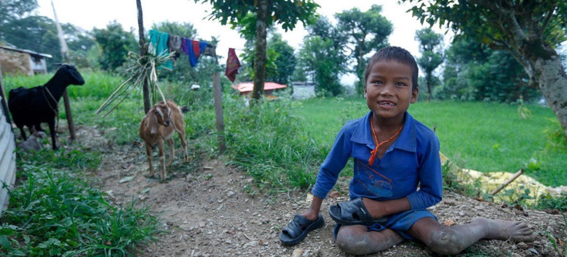 Ten year old Babu Kaji Tamang, who gets around by crawling on all fours, at his home  in Sindhupalchwok, Nepal, one of the most earthquake-affected districts.