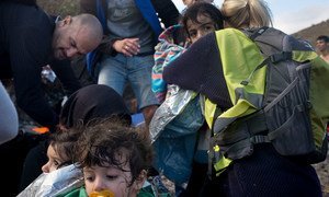 Children and their parents arrive on the Greek island of Lesbos, in the North Aegean region.