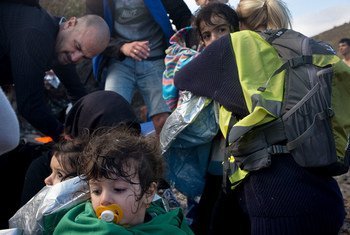 Children and their parents arrive on the Greek island of Lesbos, in the North Aegean region.