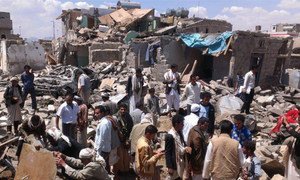 Yemenis in Sana’a search for survivors after a bombing by the Saudi-Arabia led coalition.